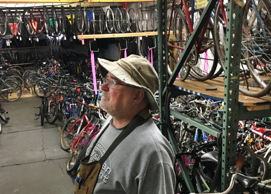 R Community Bikes founder Dan Lill in their Rochester warehouse