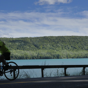 Cyclist along side coast Cooperstown Bike Tour