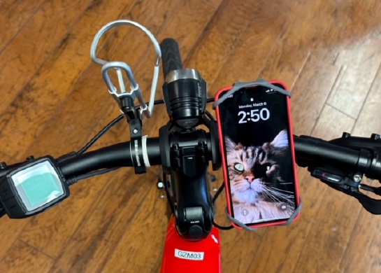 Image of a smartphone holder mounted to a bicycle handlebar.