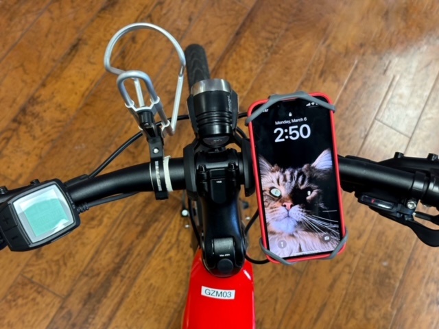 Image of a smartphone holder mounted to a bicycle handlebar.