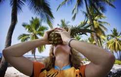 Cyclist eating a pineapple Hawaii Bike Tour