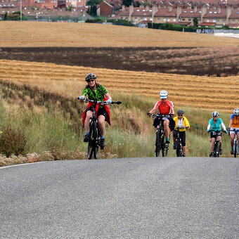 Cyclist on road Spain Camino de Santiago bike tour