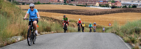 Cyclist on road Spain Camino de Santiago bike tour