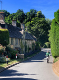 Cotswolds single cyclist rides by home vertical