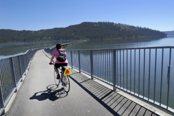 Cyclist on bridge bike path Idaho Greenways Bike Tour