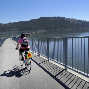 Cyclist on bridge bike path Idaho Greenways Bike Tour