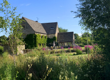 Cotswolds home seen through greenery