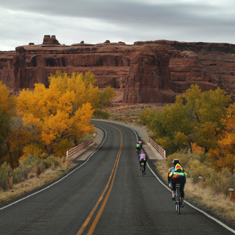 Cliff and bike path view Moab Arches and Canyonlands Bike Tour