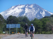 Two cyclists in Chile below Lonquimay Volcano