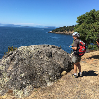 Cyclist enjoying the view Washington San Juan Islands Bike Tour