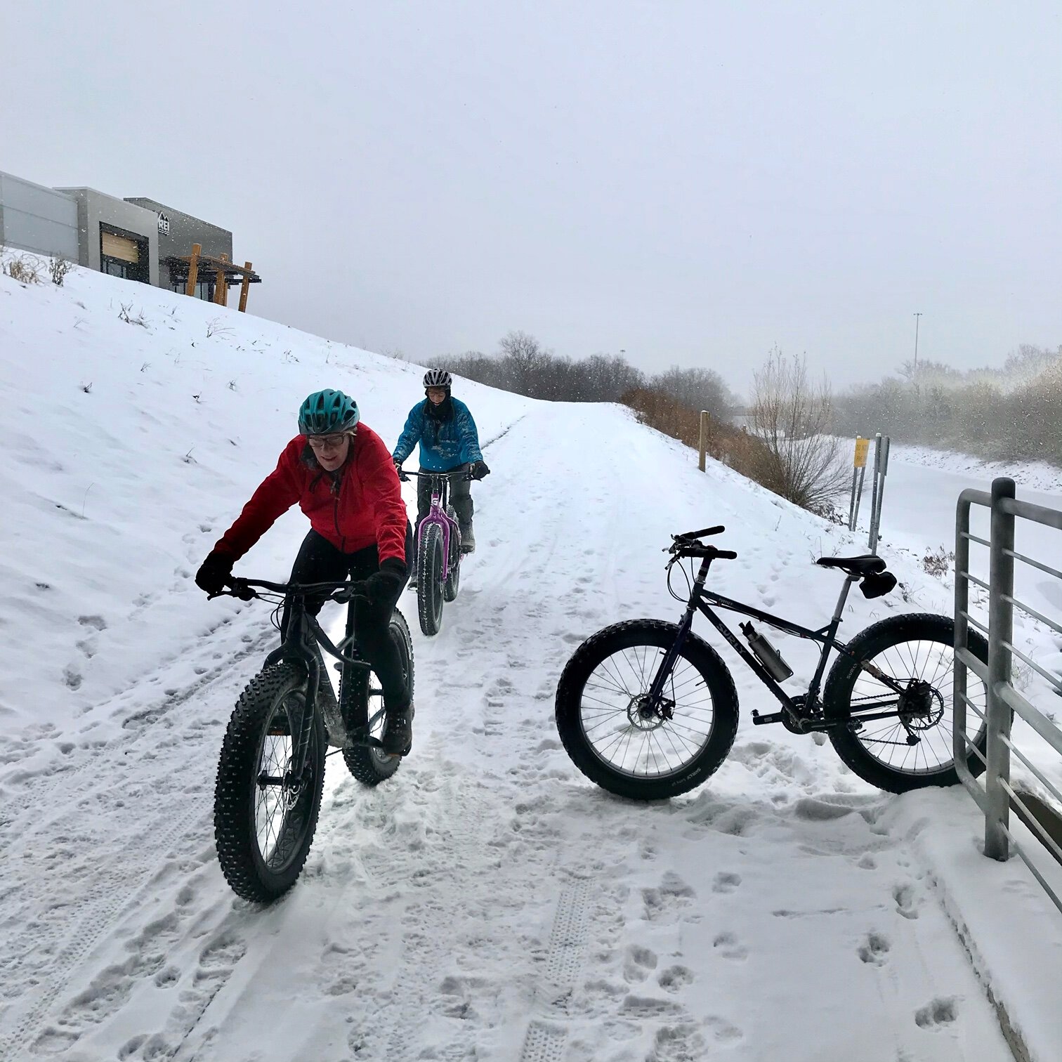 women bike riding in the winter