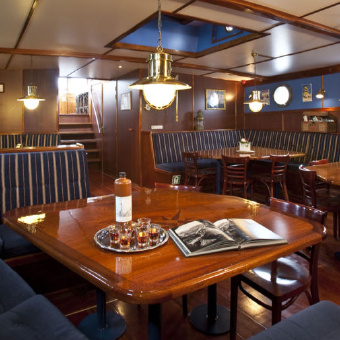 Dining room on the Wapen fan Fryslân sailboat in the Netherlands