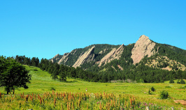 field and mountains in the Boulder Bike Tour in CO