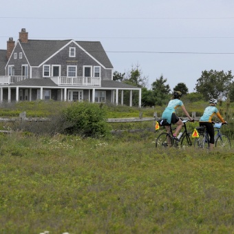 Cyclist along bike path Massachusetts Island Hopper Bike Tour
