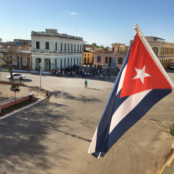 Cuban flag in town square on Cuba bike tour