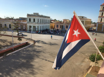 Cuban flag in town square on Cuba bike tour