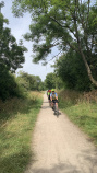 Cotswolds cyclists on dirt path vertical
