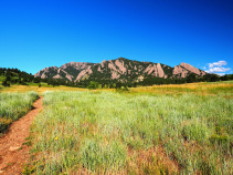 field and mountains in the Boulder Bike Tour in CO