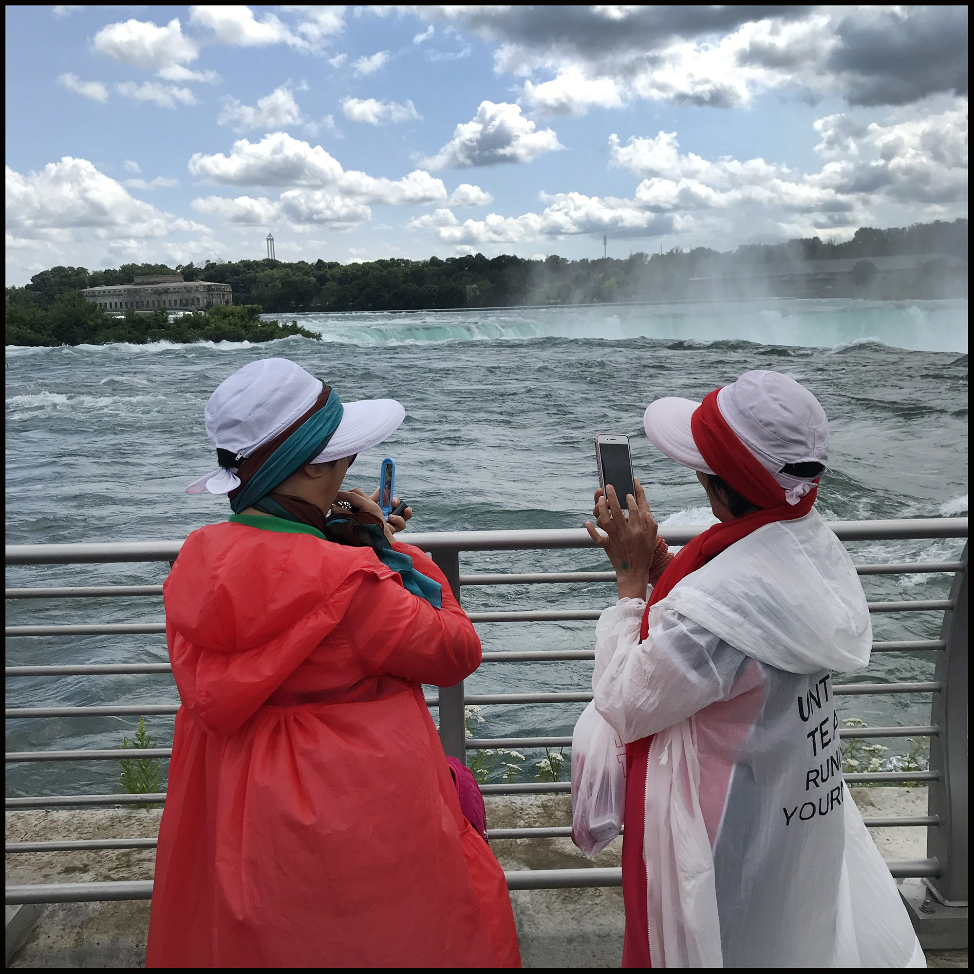 Tourists take photos at Niagara Falls.