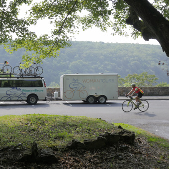 Woman tours van and cyclist Epic Bike Tour