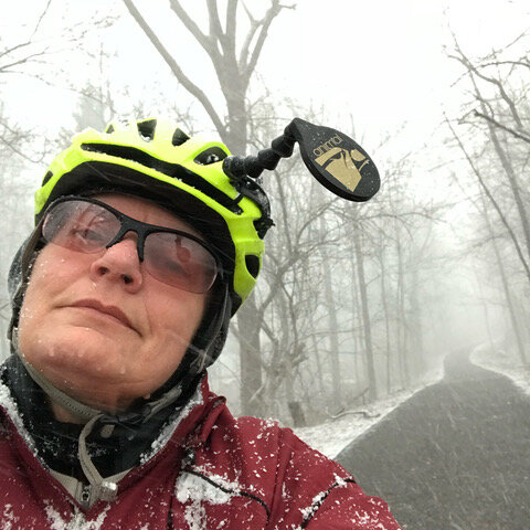 woman bike riding in the winter