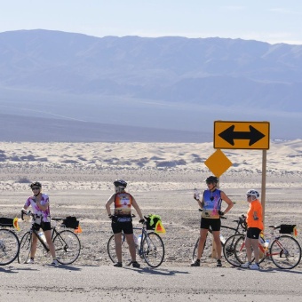 Cyclist enjoying gate desert view Death Valley Bike Tour