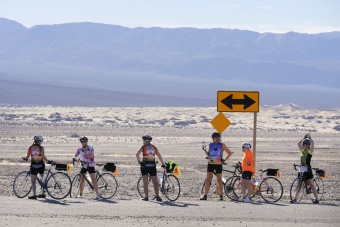 Cyclist enjoying gate desert view Death Valley Bike Tour