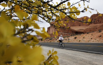 Cyclist on road during Moab Arches and Canyonlands Bike Tour