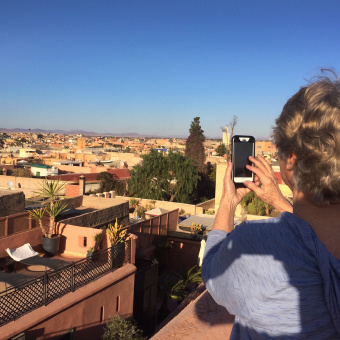 Taking a photo of view of the town Morocco Bike Tour