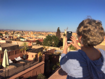 Taking a photo of view of the town Morocco Bike Tour