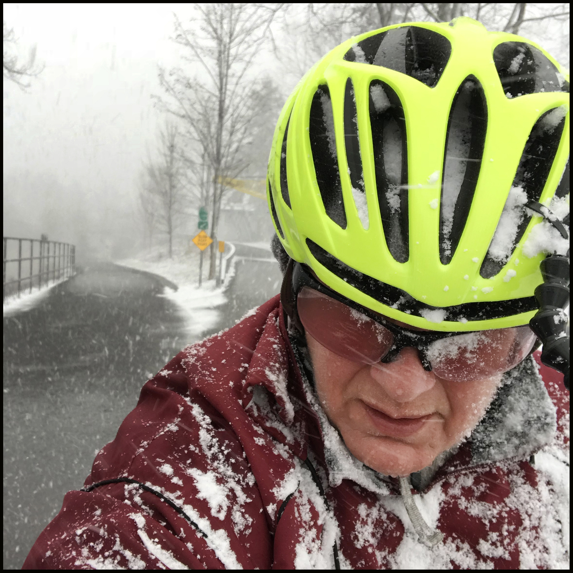 Selfie of Annette cycling in the snow.