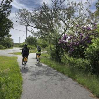 Bike path with two cyclists Massachusetts Island Hopper Bike Tour