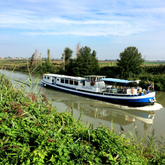 Barge in river during Italy Bike and Barge Bike Tour