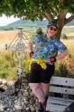 Cyclist leaning on a tress posing for a photo Spain Camino de Santiago bike tour