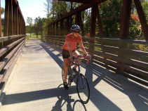 Cyclist riding on bridge Erie Canal Bike Tour