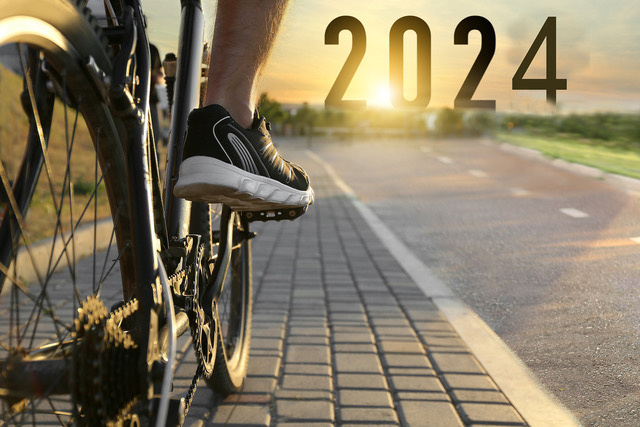 cyclist on a road with 2024