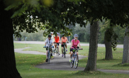 Cyclist on bike path during Niagara Falls Pathways