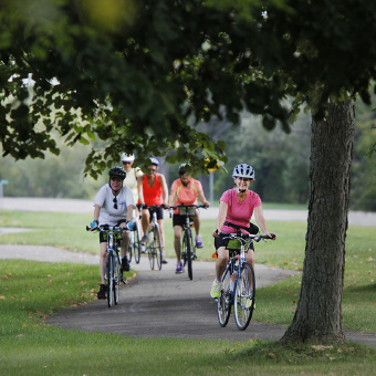 Cyclist on bike path during Niagara Falls Pathways