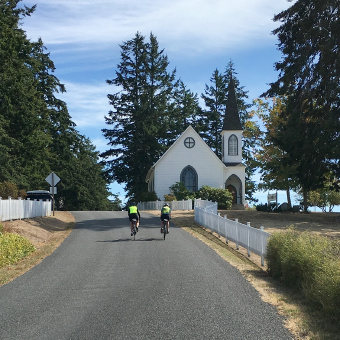 Cyclist on bike road Washington San Juan Islands Bike Tour