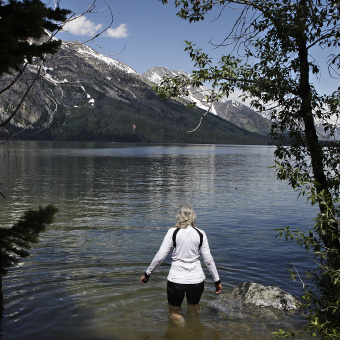 Cyclist going for a swim during Idaho Teton Valley Bike Tour