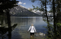 Cyclist going for a swim during Idaho Teton Valley Bike Tour