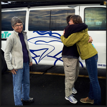 WomanTours president, Jackie hugs Nancy as Carlyn looks on before they departed with our new van headed to the west coast.