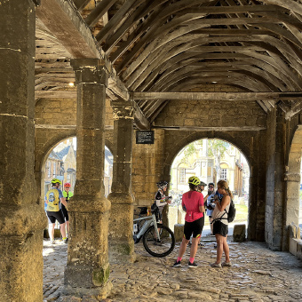 Cotswolds cyclists under old arches