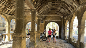 Cotswolds cyclists under old arches