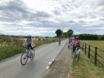 Cotswolds women on path along fence