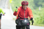 Two women cycling on a country road while on a bike tour